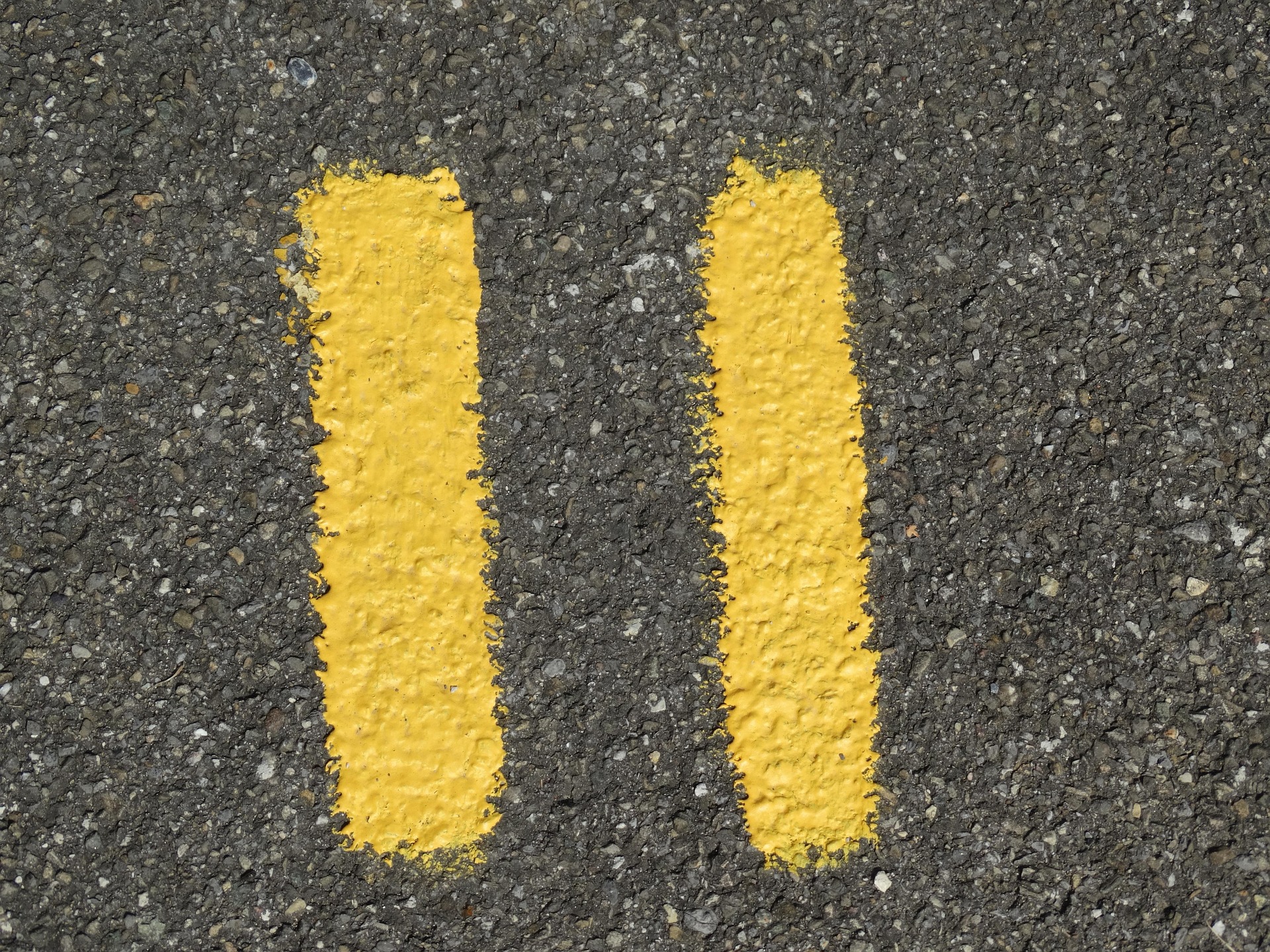 number eleven painted in yellow on pavement