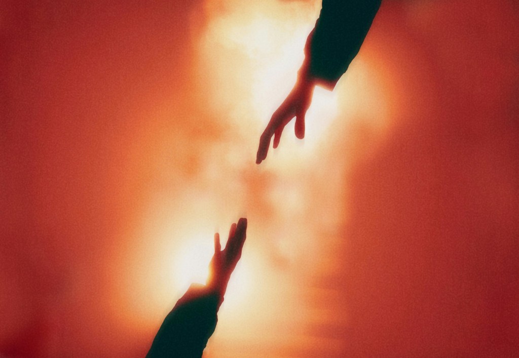 two hands separating on a background of light and surrounded by red